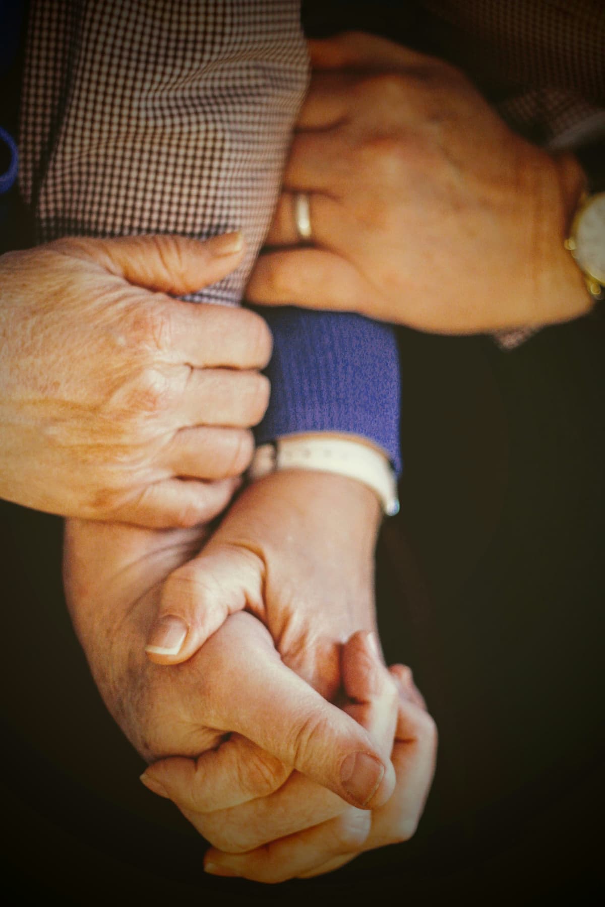 Elderly hands clasped in care - TruCare values